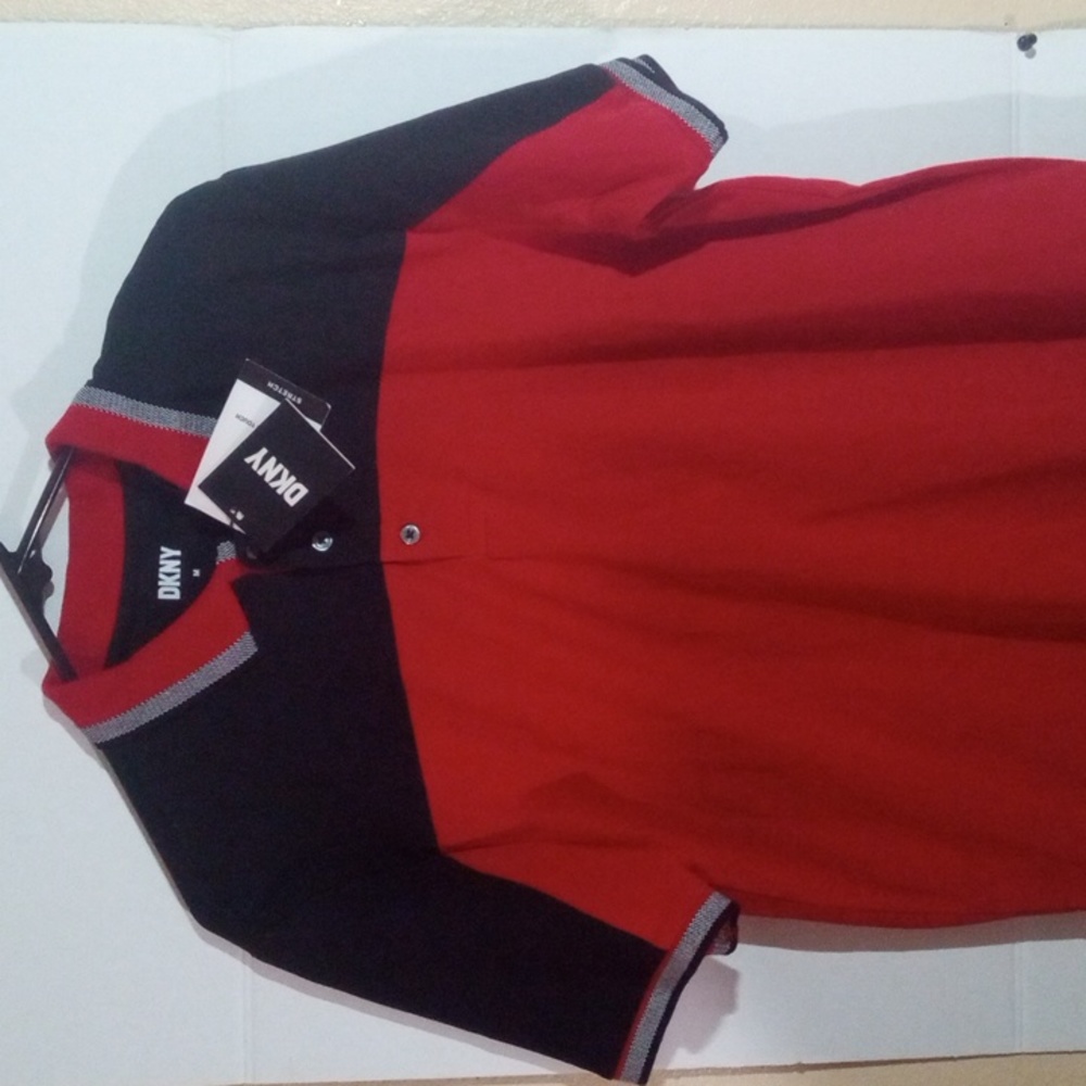 DKNY t-shirt short sleeve medium sized with a collar and three buttons